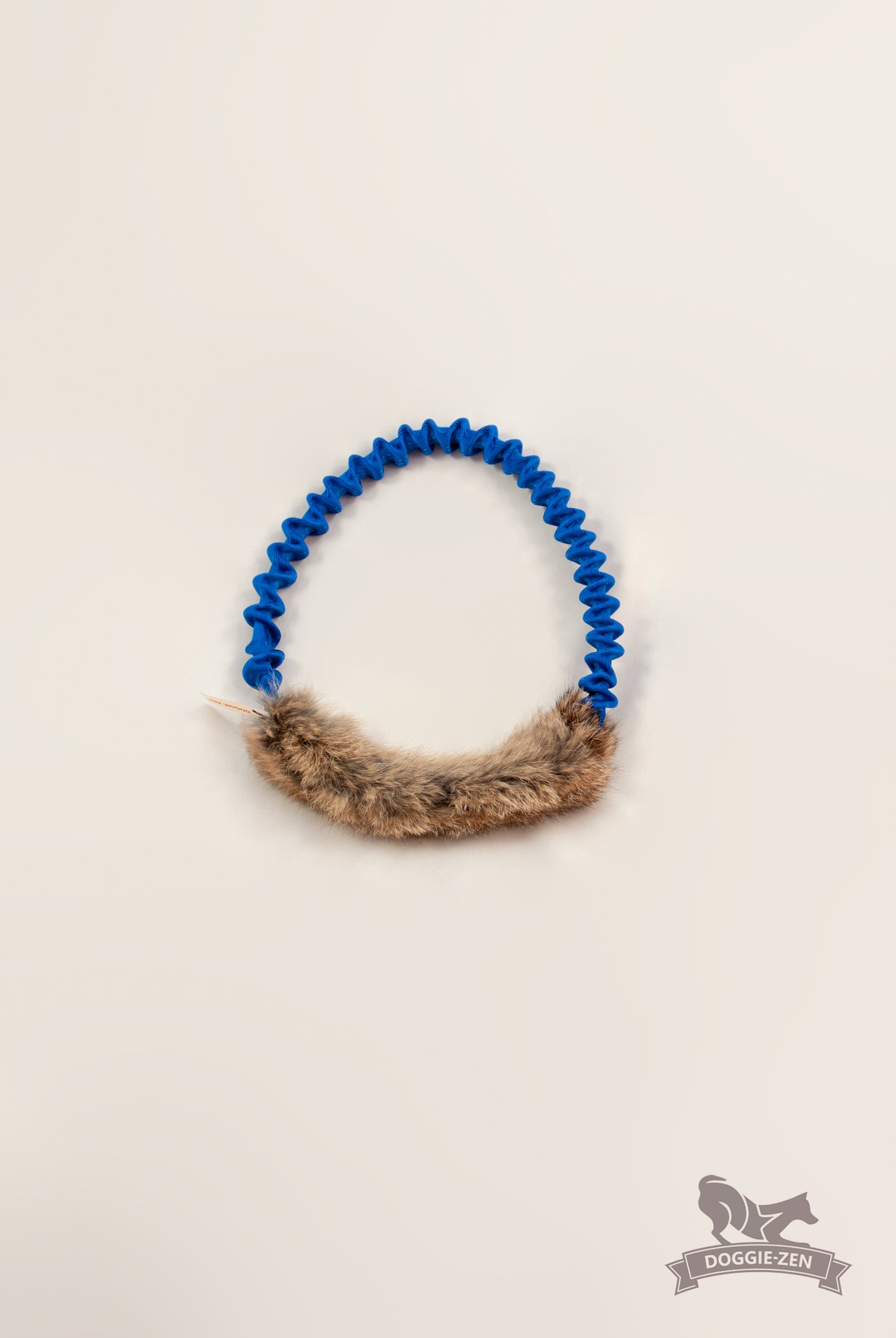 Elastisk ring med kaninskinn